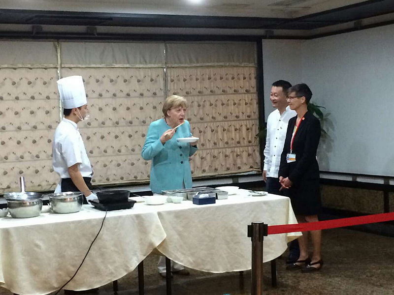 Merkel kostet Sichuan-Küche